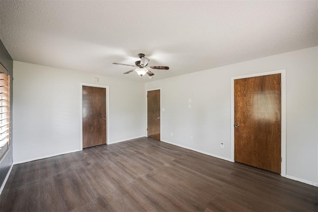 325 S Pine St, Crescent, OK 73028 - unfurnished bedroom with wood finished floors, a ceiling fan, and baseboards