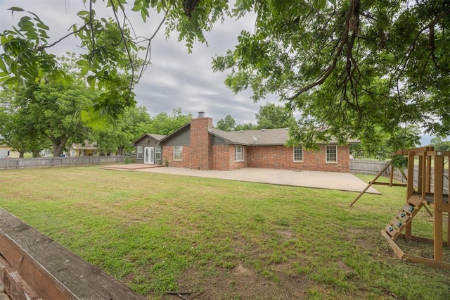 325 S Pine St, Crescent, OK 73028 - view of yard with a patio and a playground