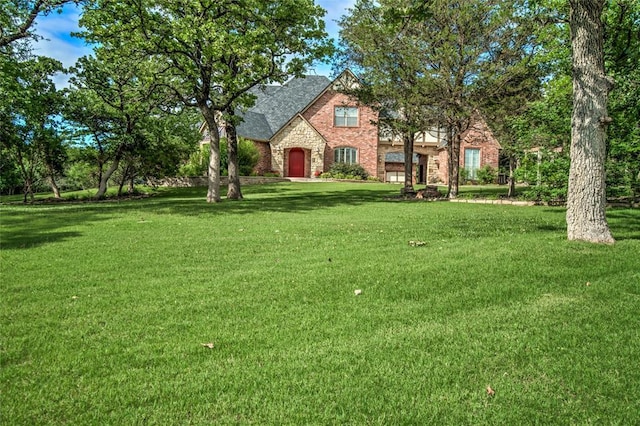 8025 Redbud Canyon Trl, Edmond, OK 73034 - view of green lawn featuring a garage