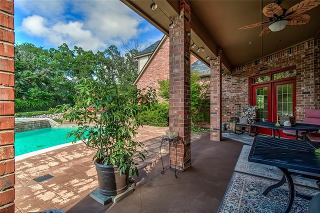 8025 Redbud Canyon Trl, Edmond, OK 73034 - view of patio featuring ceiling fan and an outdoor pool