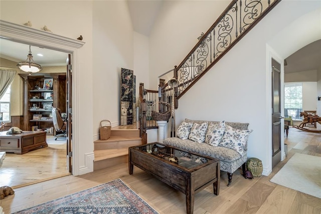 8025 Redbud Canyon Trl, Edmond, OK 73034 - living room with light wood-style flooring, healthy amount of natural light, lofted ceiling, stairway, and an office area