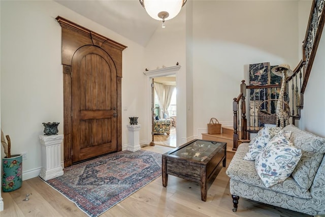8025 Redbud Canyon Trl, Edmond, OK 73034 - entryway featuring wood finished floors, vaulted ceiling, and baseboards
