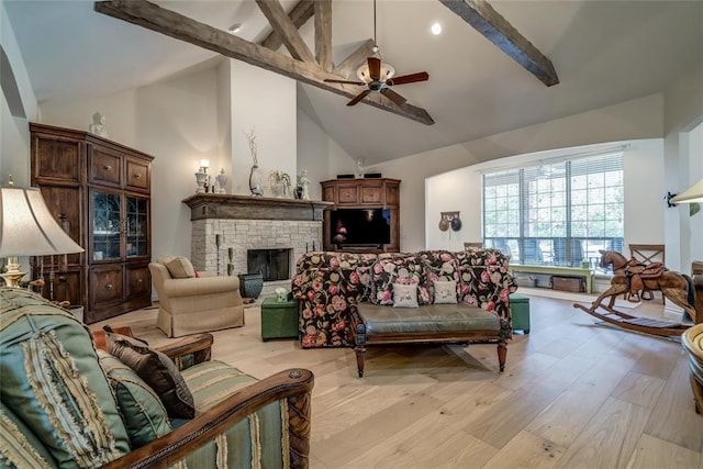 8025 Redbud Canyon Trl, Edmond, OK 73034 - living room with a brick fireplace, beam ceiling, a ceiling fan, light wood-type flooring, and high vaulted ceiling