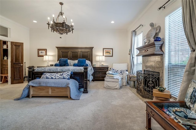 8025 Redbud Canyon Trl, Edmond, OK 73034 - bedroom featuring a fireplace, light carpet, a chandelier, crown molding, and recessed lighting