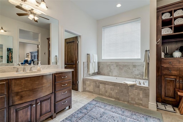 8025 Redbud Canyon Trl, Edmond, OK 73034 - bathroom featuring vanity, a garden tub, a ceiling fan, and tile patterned floors