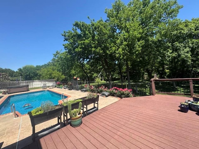 3826 Creek Bank Dr, Edmond, OK 73003 - view of swimming pool featuring a wooden deck and a fenced backyard