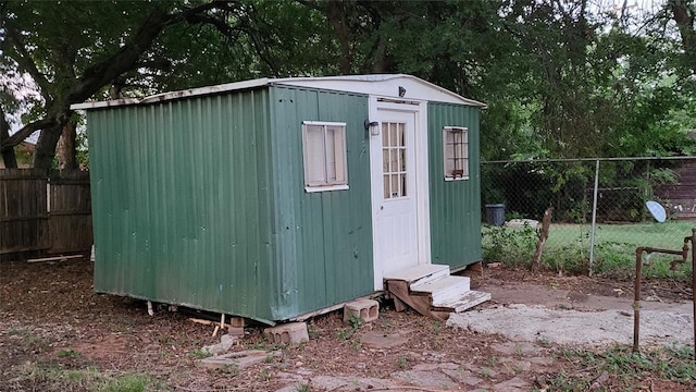 929 NE 17th St, Oklahoma City, OK 73105 - view of shed featuring entry steps and a fenced backyard