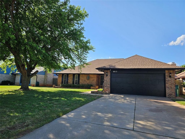6013 Greenview Dr, Oklahoma City, OK 73135 - single story home with concrete driveway, an attached garage, brick siding, and a front yard