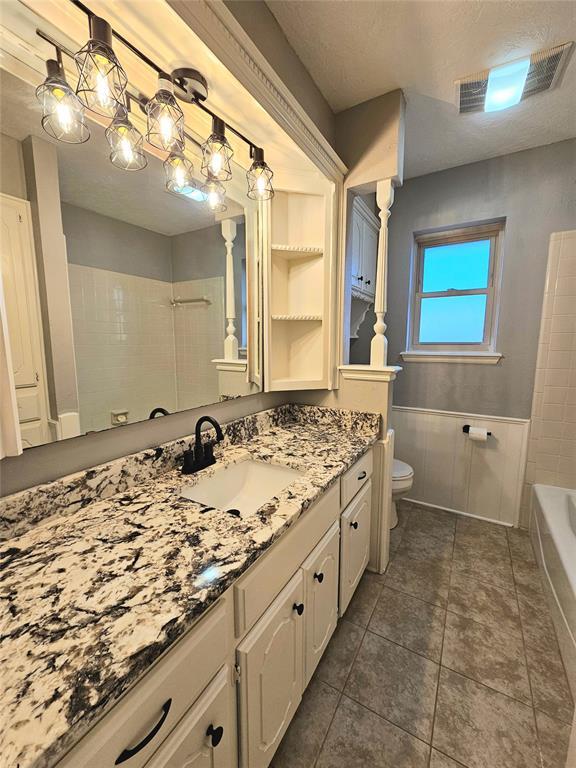 6013 Greenview Dr, Oklahoma City, OK 73135 - bathroom with a bath, vanity, toilet, a shower, and tile patterned flooring