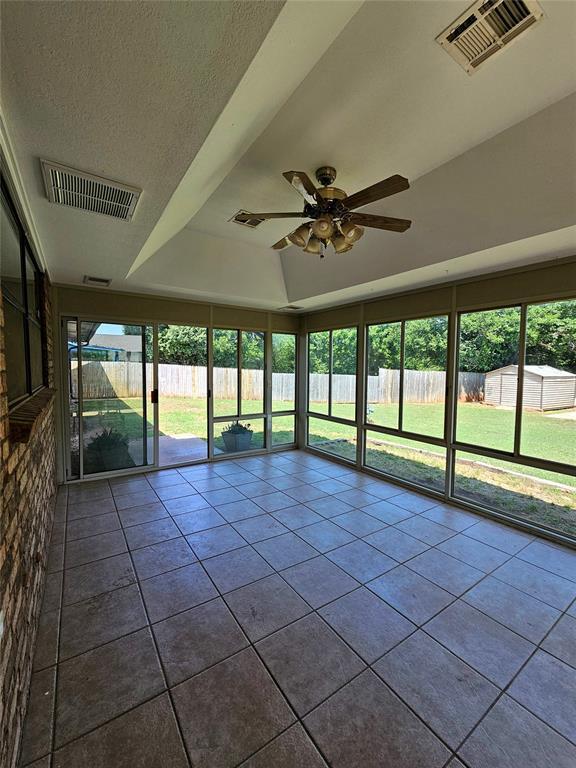 6013 Greenview Dr, Oklahoma City, OK 73135 - unfurnished sunroom featuring a ceiling fan and plenty of natural light