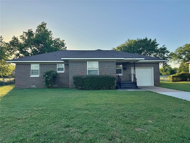 1618 NW 24th St, Lawton, OK 73505 - ranch-style home featuring an attached garage, brick siding, a front lawn, and crawl space