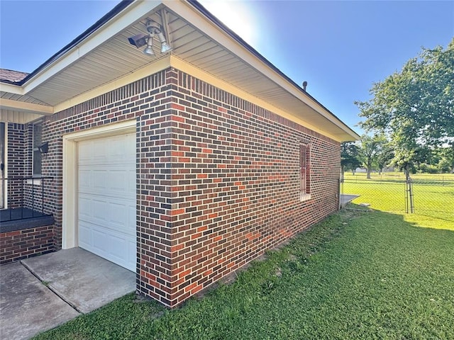 1618 NW 24th St, Lawton, OK 73505 - view of property exterior with brick siding, an attached garage, and concrete driveway