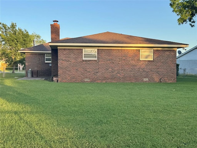 1618 NW 24th St, Lawton, OK 73505 - view of home's exterior featuring crawl space, a chimney, and brick siding