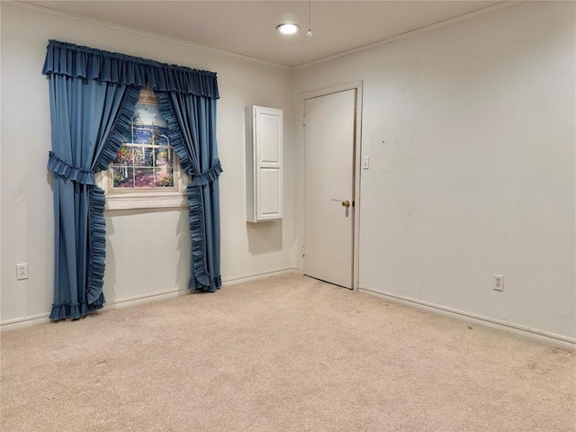 1618 NW 24th St, Lawton, OK 73505 - spare room with light carpet, baseboards, and ornamental molding