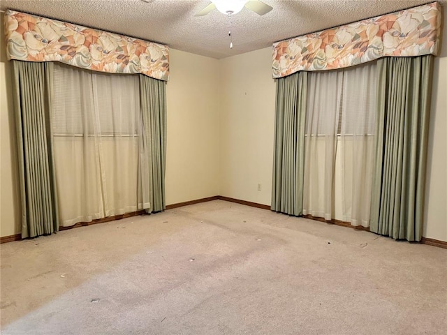 1618 NW 24th St, Lawton, OK 73505 - spare room with carpet, a textured ceiling, ceiling fan, and baseboards