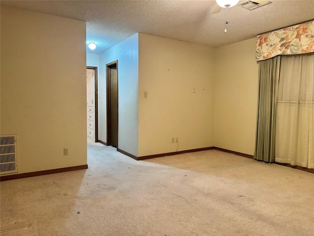 1618 NW 24th St, Lawton, OK 73505 - carpeted empty room with a textured ceiling, a ceiling fan, and baseboards