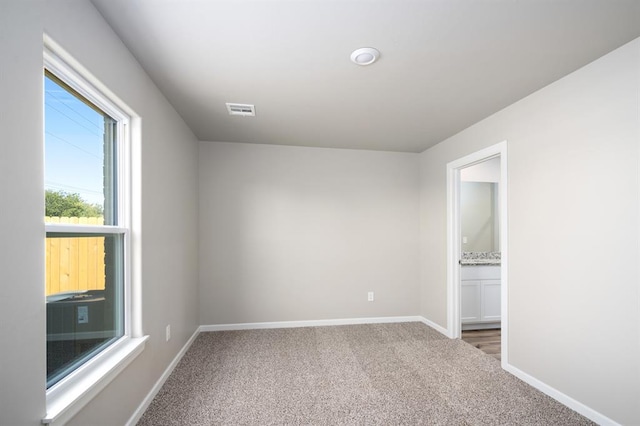 12704 Torretta Way, Yukon, OK 73099 - carpeted spare room with baseboards