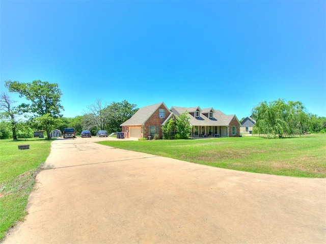 5509 Old Town St, Newalla, OK 74857 - new england style home featuring concrete driveway, a front lawn, and an attached garage