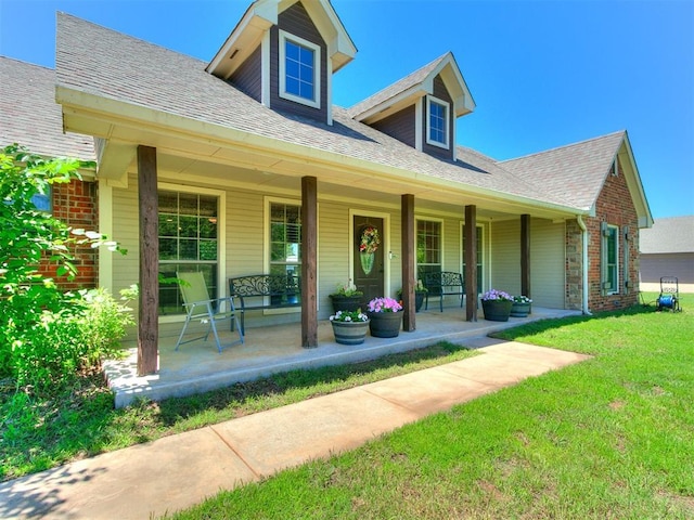 5509 Old Town St, Newalla, OK 74857 - view of front of home with a porch, a front lawn, and roof with shingles