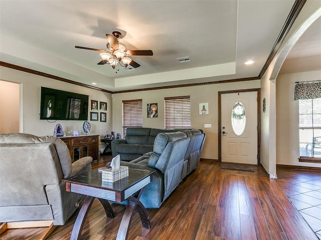 5509 Old Town St, Newalla, OK 74857 - living area featuring a tray ceiling, ceiling fan, arched walkways, dark wood-style flooring, and recessed lighting