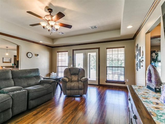 5509 Old Town St, Newalla, OK 74857 - living room with a raised ceiling, dark wood-style flooring, ceiling fan, recessed lighting, and ornamental molding