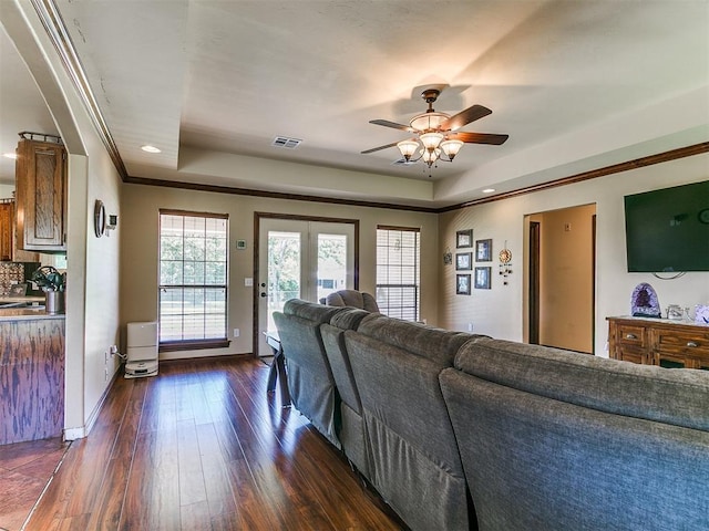 5509 Old Town St, Newalla, OK 74857 - living area featuring a raised ceiling, ceiling fan, dark wood finished floors, baseboards, and recessed lighting