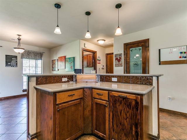 5509 Old Town St, Newalla, OK 74857 - kitchen featuring tile patterned flooring, baseboards, and pendant lighting