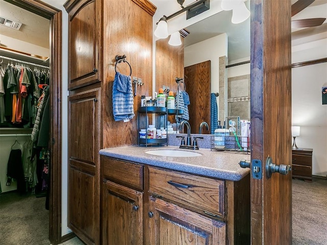 5509 Old Town St, Newalla, OK 74857 - full bathroom with vanity, a spacious closet, and ceiling fan