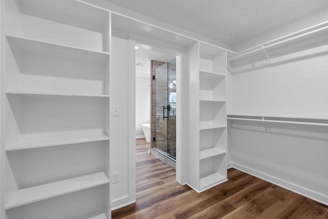 3155 E Fair St, Idabel, OK 74745 - spacious closet featuring wood finished floors