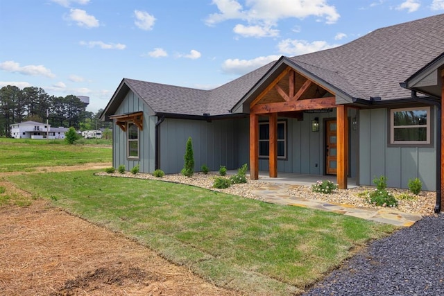 3155 E Fair St, Idabel, OK 74745 - modern inspired farmhouse with board and batten siding, a shingled roof, a front yard, and a porch