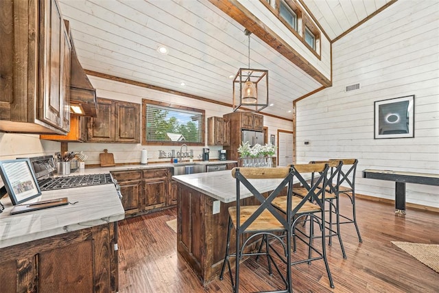 168 Eagle Mountain Trl, Broken Bow, OK 74728 - kitchen with dark wood-type flooring, a sink, wood walls, wooden ceiling, and decorative light fixtures