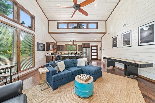 168 Eagle Mountain Trl, Broken Bow, OK 74728 - living room featuring wooden walls, a ceiling fan, wood finished floors, and high vaulted ceiling