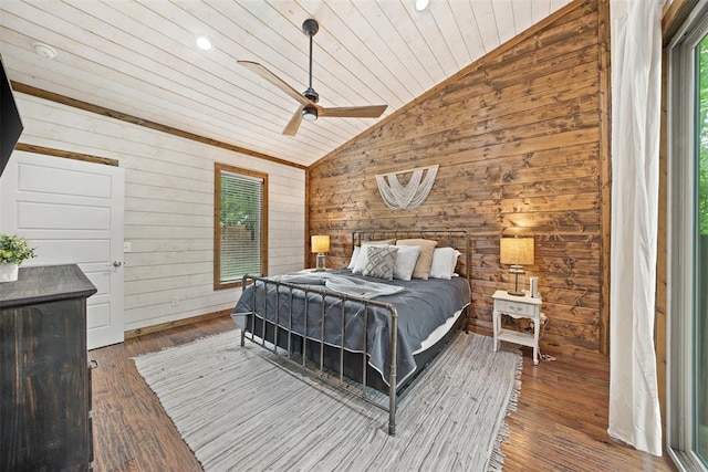 168 Eagle Mountain Trl, Broken Bow, OK 74728 - bedroom with vaulted ceiling, wood ceiling, multiple windows, wood walls, and wood finished floors
