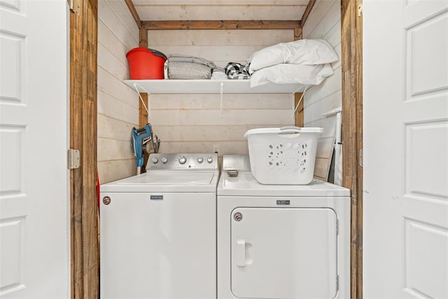 168 Eagle Mountain Trl, Broken Bow, OK 74728 - laundry area featuring washer and clothes dryer and wooden walls