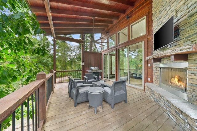 168 Eagle Mountain Trl, Broken Bow, OK 74728 - wooden deck featuring grilling area and an outdoor living space with a fireplace