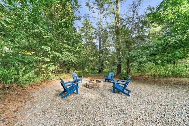 168 Eagle Mountain Trl, Broken Bow, OK 74728 - view of yard with an outdoor fire pit