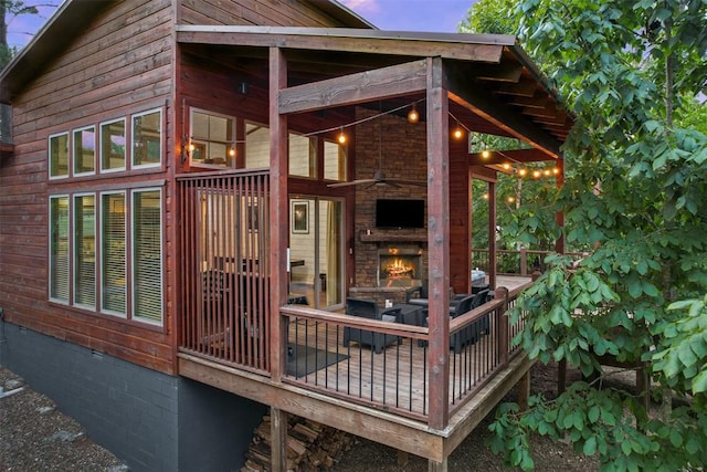 168 Eagle Mountain Trl, Broken Bow, OK 74728 - deck with an outdoor stone fireplace