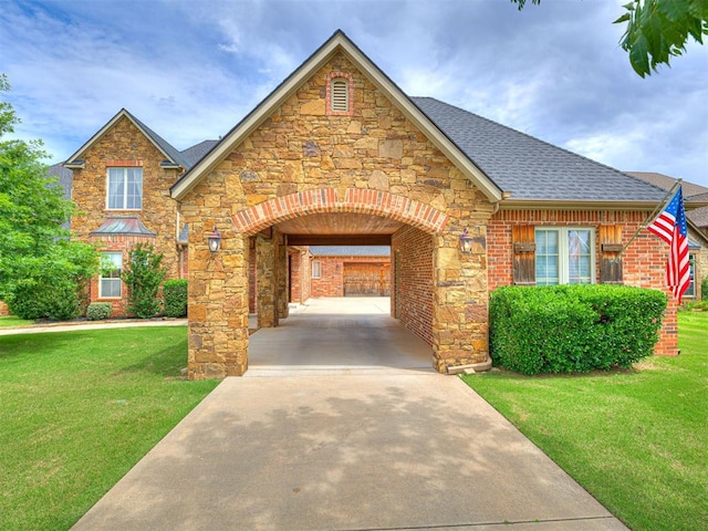 6509 NE 101st St, Oklahoma City, OK 73151 - view of front of house with stone siding, a front lawn, roof with shingles, and brick siding