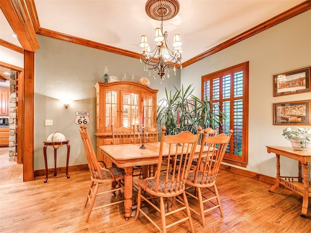 6509 NE 101st St, Oklahoma City, OK 73151 - dining space featuring baseboards, a chandelier, ornamental molding, and light wood-style flooring