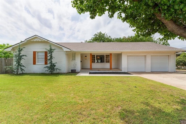 6201 N Styll Rd, Oklahoma City, OK 73112 - ranch-style home with a garage, brick siding, concrete driveway, and covered porch