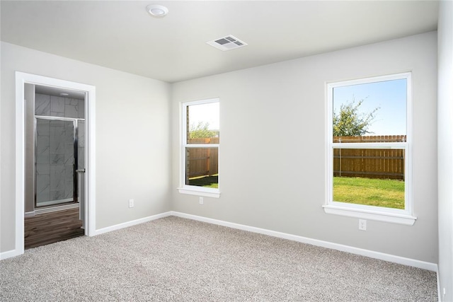 12708 Torretta Way, Yukon, OK 73099 - unfurnished bedroom featuring carpet and baseboards