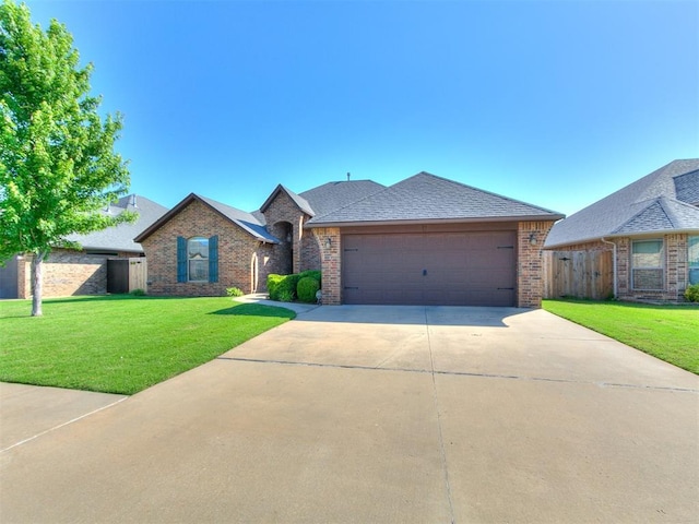 17016 Barcelona Dr, Oklahoma City, OK 73170 - ranch-style home featuring brick siding, concrete driveway, a garage, and a shingled roof