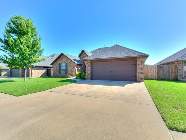 17016 Barcelona Dr, Oklahoma City, OK 73170 - ranch-style house featuring brick siding, a shingled roof, concrete driveway, and an attached garage