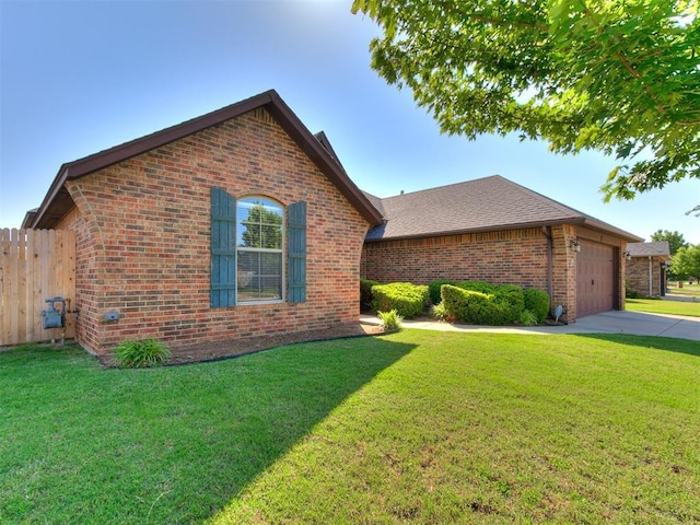 17016 Barcelona Dr, Oklahoma City, OK 73170 - view of front of home featuring brick siding, a garage, concrete driveway, and roof with shingles