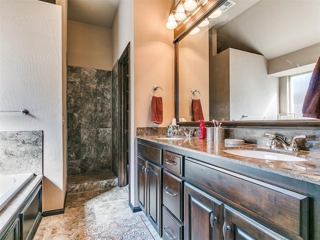 17016 Barcelona Dr, Oklahoma City, OK 73170 - full bath featuring double vanity, tiled shower, a bath, and stone finish flooring