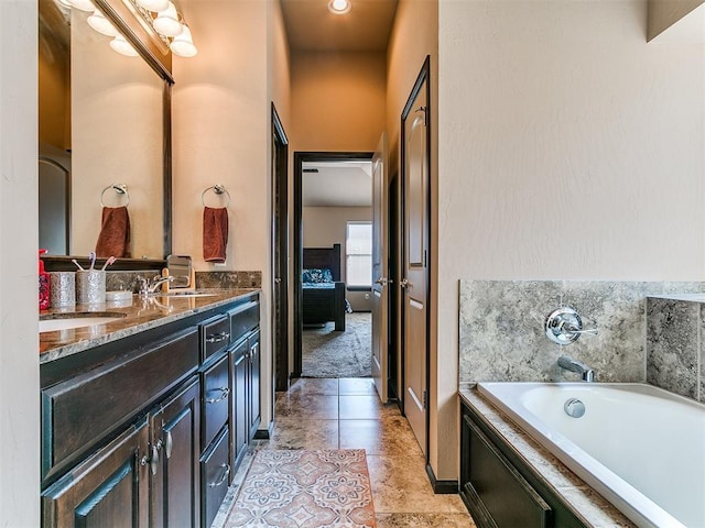 17016 Barcelona Dr, Oklahoma City, OK 73170 - full bath featuring double vanity, a bath, ensuite bathroom, tile patterned flooring, and baseboards