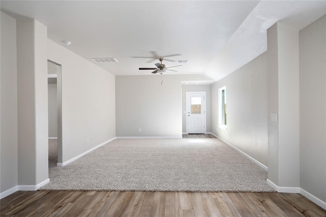 9304 NW 126th St, Yukon, OK 73099 - carpeted spare room featuring baseboards, ceiling fan, wood finished floors, lofted ceiling, and a smoke detector