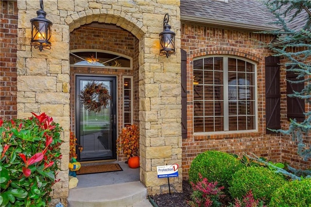 16000 SW 25th St, Oklahoma City, OK 73036 - doorway to property with brick siding, roof with shingles, and stone siding