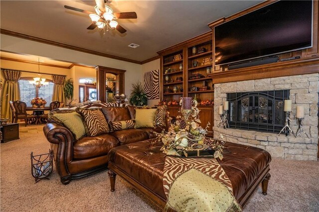 16000 SW 25th St, Oklahoma City, OK 73036 - living room with carpet floors, a chandelier, ornamental molding, a ceiling fan, and a stone fireplace