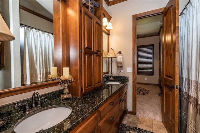 16000 SW 25th St, Oklahoma City, OK 73036 - bathroom featuring crown molding, double vanity, and baseboards